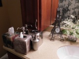 Contents of Bathroom- Scale, Tissue Dispenser, Soap Dispenser, Decorative E