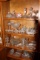Contents of Cabinet: Clear Glass Jars, Footed Pressed Glass Bowls, Vases, C