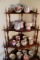 Contents of Corner Shelf To Include: Various Mustache Cops, Decorative Cups