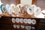 (21) Decorative Porcelain Plates on Stands and (2) Decorative Porcelain Wal