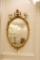 Beveled mirror Oval w/crest, rope and swag carving