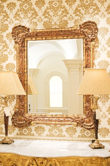 Mirror carved in stained pine w/large triple shell motif in corners and gil
