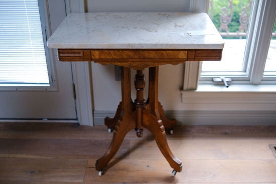 Walnut Eastlake Victorian table original porcelain casters, white marble to