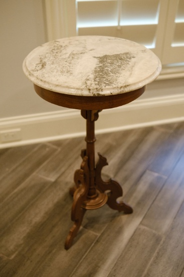 Victorian walnut candle stick table with a marbletop,  circa 1870 to 1880,