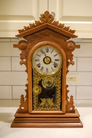 Walnut renaissance revival shelf clock, w/chime enamel face and reverse pai