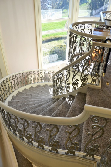 Custom Iron Stairway and rails w/white painted banister, from the upper sup