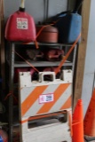 Large Assortment of Fuel Cans and Safety Items, Under the Orange Ribbon