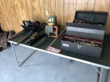 Contents of Table : To include: tool box with tools , electric chain saw ,