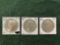 (3) Peace Dollars: (1) 1934 Mint Mark D Au, (1) 1934 Mint Mark D Uncirculat