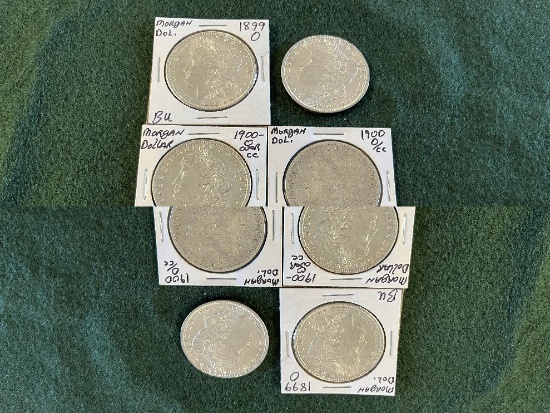(7) Morgan Silver Dollars: (1) 1899 Mint mark O BU (1) 1900 No Mint Mark Ung