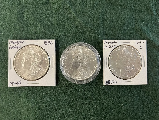 (3) Morgan Silver Dollars: (1) 1896 No Mint Mark MS-63, (1) 1897 Mint Mark