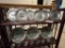 Wooden 3 Shelf Unit with Assortment of Presidential Themed Plates