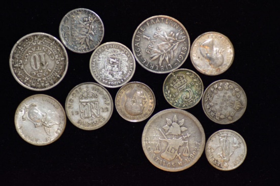 11 FOREIGN COINS