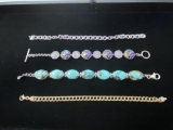 FOUR STERLING BRACELETS