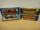 2 HO ENGINES AND 2 PASSENGER CARS