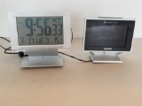 PAIR OF MULTIFUNCTION CLOCKS