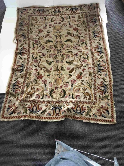 FLORAL RUG WITH TANS REDS AND BLUES