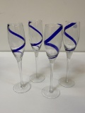 FOUR BLUE SWIRL GLASS CHAMPAGNE FLUTES