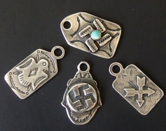 FOUR (4) VINTAGE NAVAJO STERLING PENDANTS