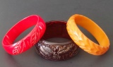 THREE (3) VINTAGE CARVED BAKELITE BANGLES