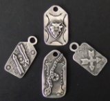 FOUR (4) VINTAGE NAVAJO STERLING PENDANTS