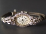 14KT GOLD & DIAMOND CASE LADIES WRIST WATCH