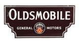 Oldsmobile General Motors Porcelain Die-Cut Sign.