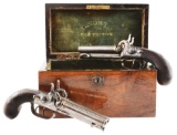(A) Cased Pair of English Double Barrel Percussion Pistols by T. North.