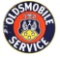 Oldsmobile Service Porcelain Sign with Crest Graphic.