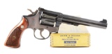 (C) Gold Box Smith & Wesson K-38 Masterpiece Double Action Revolver (1950).