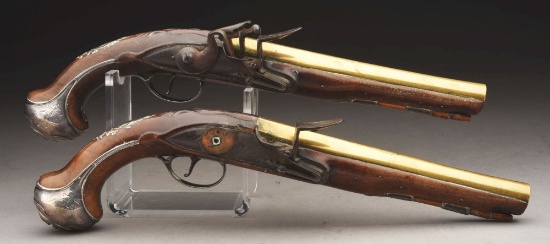 (a) Pair Of Brass Barreled And Silver Mounted Flintlock Officer's Pistols By Wilson.