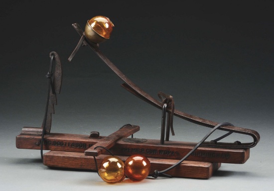 Captain Bogardus Glass Ball Thrower with Three Amber Balls.