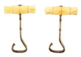 SPECTACULAR PAIR OF IVORY HANDLED MID-19TH CENTURY BOOT PULLS.