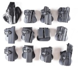 ENORMOUS LOT OF HOLSTERS, MOSTLY SIG AND WALTHER.