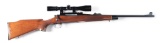 (M) REMINGTON MODEL 700 BOLT ACTION RIFLE WITH SCOPE.