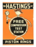 Hastings Piston Rings Test Station Tin Sign W/ Detective Hastings Graphic.