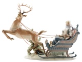 Lladro Figurine of Reindeer Pulling Sled with Woman and Child Inside.