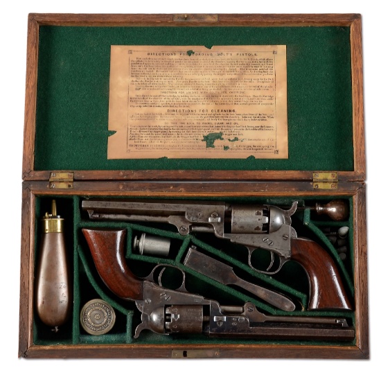 (A) CASED PAIR OF CONSECUTIVE COLT 1849 POCKET PERCUSSION REVOLVERS.