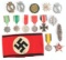 LOT OF 14: MISCELLANEOUS GERMAN WORLD WAR II MEDALS, COMBAT BADGES, AND SS ARMBAND.