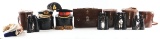 LOT OF 8: BRITISH MILITARY HEADDRESS, BINOCULARS AND BRIEFCASE WITH SPURIOUS MARKINGS.