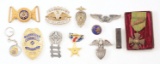 LOT OF 11: MISCELLANEOUS MILITARY MEDALS AND INSIGNIA.