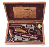 (A) CASED PAIR OF ENGRAVED COLT 1849 POCKET PERCUSSION REVOLVERS.