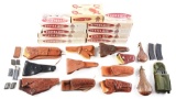 LARGE LOT OF HOLSTERS, MAGAZINES AND FLASKS.