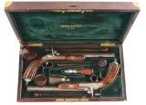 (A) AN ATTRACTIVE CASED PAIR OF LEFAUCHEUX PERCUSSION PISTOLS.