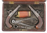 (A) DIMINUTIVE CASED PAIR OF POCKET PISTOLS WITH ACCESSORIES BY BAKER.