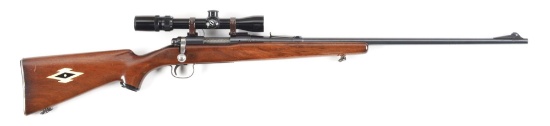 (C) REMINGTON 722 BOLT ACTION RIFLE WITH SCOPE.
