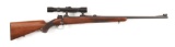 (C) FABRIQUE NATIONAL SPORTING BOLT ACTION RIFLE WITH SCOPE.