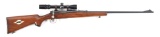 (C) REMINGTON 722 BOLT ACTION RIFLE WITH SCOPE.