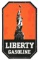 RARE LIBERTY GASOLINE PORCELAIN SERVICE STATION SIGN W/ STATUE OF LIBERTY GRAPHIC.