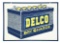 DELCO DRY CHARGE BATTERIES NEW OLD STOCK TIN SERVICE STATION SIGN.